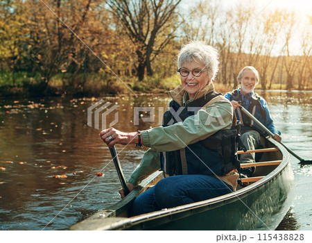 Senior couple, kayak and rowing in river for holiday, travel or summer vacation in water outdoor together. Man, woman and canoe boat in lake on transport for adventure, exercise and happy in nature 115438828
