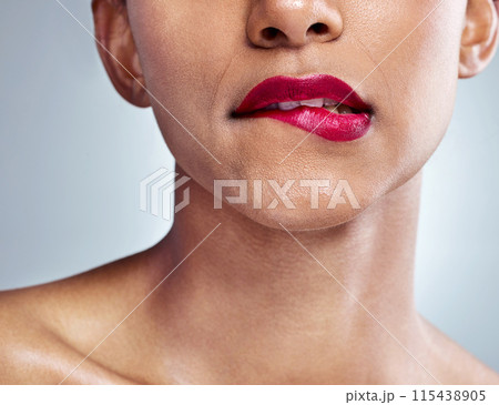 Woman, lips and lipstick for natural beauty and cosmetics, skin and closeup isolated on studio background. Model, sensual and makeup with skincare, shine and dermatology, bite and playful for fun 115438905