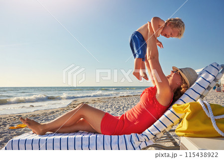 Woman, lifting and boy on beach in playing on holiday, vacation in Istanbul for happiness or memory. Excited, mom and child for relax, together and bonding in play for growth, development or love 115438922