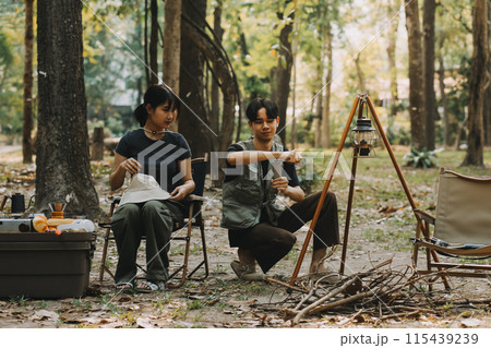 Asian couple sweet in tent inside on they camping trip, traveller relax and sleep togather in out door and camping trip Asian couple sweet in tent inside on they camping trip, traveller relax and sleep togather in out door and camping trip 115439239
