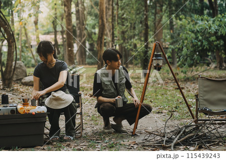 Asian couple sweet in tent inside on they camping trip, traveller relax and sleep togather in out door and camping trip 115439243