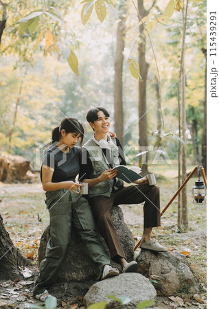 Asian couple sweet in tent inside on they camping trip, traveller relax and sleep togather in out door and camping trip Asian couple sweet in tent inside on they camping trip, traveller relax and sleep togather in out door and camping trip 115439291