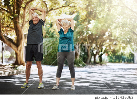 Outdoor, stretching and old couple with exercise, fitness and workout with sunshine, challenge and energy. Park, senior man and mature woman with balance, wellness and cardio with health and nature 115439362