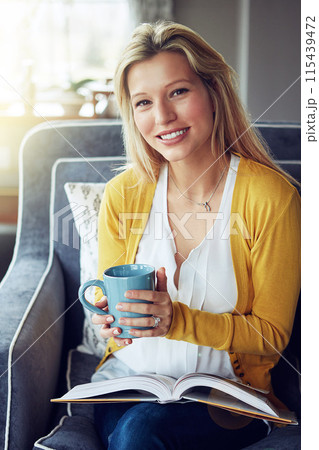 Home, portrait and woman with coffee, sofa and reading in weekend, book and break in living room. House, couch and face of person with tea, peace and smile for rest in lounge, drink and happiness Home, portrait and woman with coffee, sofa and reading in weekend, book and break in living room. House, couch and face of person with tea, peace and smile for rest in lounge, drink and happiness 115439472