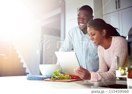 Couple, tablet and cooking in kitchen for salad, online recipe and vegetables for nutrition dinner. People, marriage and ingredients for food in home, bonding and meal prep website for instructions Couple, tablet and cooking in kitchen for salad, online recipe and vegetables for nutrition dinner. People, marriage and ingredients for food in home, bonding and meal prep website for instructions 115439560