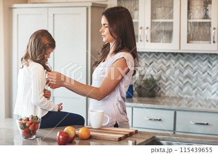 Counter, mother and love for daughter, kitchen or bonding in weekend, house and kid with smile for parent. Home, child and mom with girl, care and together in morning, peace or happiness in apartment 115439655