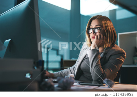 Woman, employee and thinking on computer in office on browsing internet, online and research for ideas. Female person, business and night with deadline or overtime, project and reading as hr 115439958