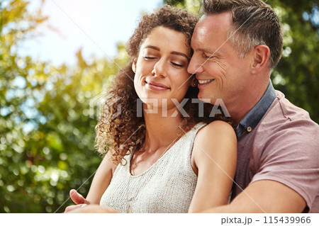Smile, couple and hug for commitment to marriage, relationship and happiness on summer vacation. Excited, husband and wife with love embrace for anniversary, support and bonding together in nature 115439966