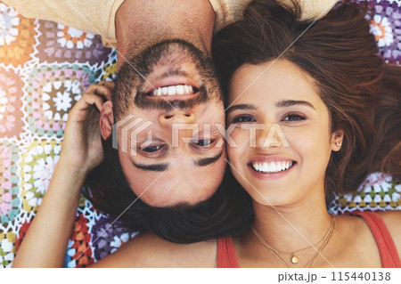 Couple, portrait and above with smile on blanket, relax and upside down on picnic, holiday and bonding. Indian people, man and woman with headshot for connection, love and care on vacation in Mumbai Couple, portrait and above with smile on blanket, relax and upside down on picnic, holiday and bonding. Indian people, man and woman with headshot for connection, love and care on vacation in Mumbai 115440138