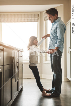 Dancing, home and child on feet of dad listening to music, playlist or radio in kitchen together. Smile, fun and happy father teaching girl kid to groove for bonding on weekend in family house. 115440505