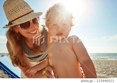 Woman, portrait and child on beach as family on holiday, vacation in Istanbul for happiness or memory. Excited, parent and ocean for relax, together and bonding as mom for growth, development or love 115440521