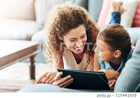 Family, woman and child with tablet in watching on weekend, break at home for e learning or gaming. Happy people, lounge and relax in together for bonding as parent for growth, development and love Family, woman and child with tablet in watching on weekend, break at home for e learning or gaming. Happy people, lounge and relax in together for bonding as parent for growth, development and love 115441078
