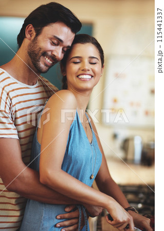 Man, woman and hug with cooking in kitchen, smile and care with diet, health and prepare lunch in home. Indian people, happy couple and embrace with connection, love and meal prep for dinner in house 115441337