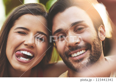 Couple, selfie and tongue out in portrait, outdoor and smile with love for post on social media. Man, woman and happy with photography for profile picture, funny face and laughing with memory in park 115441341