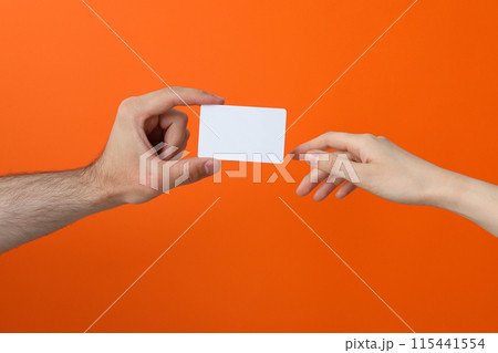 Female and male hand with blank paper 115441554