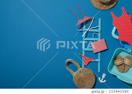 Miniature summer things for relaxing on the beach, near the sea. Miniature summer things for relaxing on the beach, near the sea. 115441593