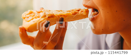 Cropped image of woman holding pizza slice at restaurant Cropped image of woman holding pizza slice at restaurant 115441799