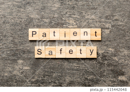 Patient Safety word written on wood block. Patient Safety text on cement table for your desing, concept Patient Safety word written on wood block. Patient Safety text on cement table for your desing, concept 115442048