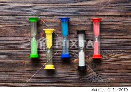 hourglass on the table, sand clock as time passing concept for business deadline, copy space hourglass on the table, sand clock as time passing concept for business deadline, copy space 115442610