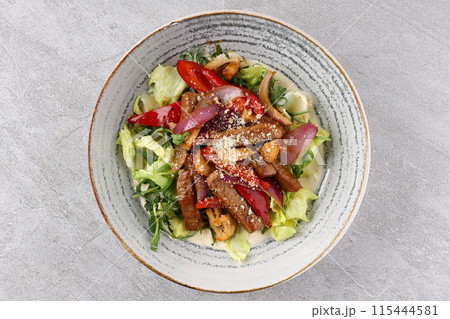 Beef steak salad with cherry tomatoes, cucumbers, red onions, romaine salad and lime mustard olive oil salad dressing Beef steak salad with cherry tomatoes, cucumbers, red onions, romaine salad and lime mustard olive oil salad dressing 115444581