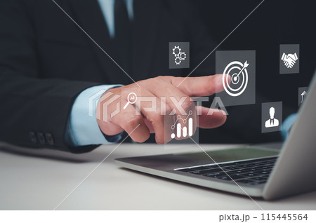 Businessman pointing finger at business target icon, Targeting the business concept, Business Growth and Vision, Business goal, Digital marketing, Set goals for better results, Marketing planning. 115445564