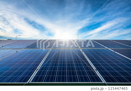 Photovoltaic solar power panel on dramatic sunset blue sky background, green clean Alternative power energy concept. Photovoltaic solar power panel on dramatic sunset blue sky background, green clean Alternative power energy concept. 115447465