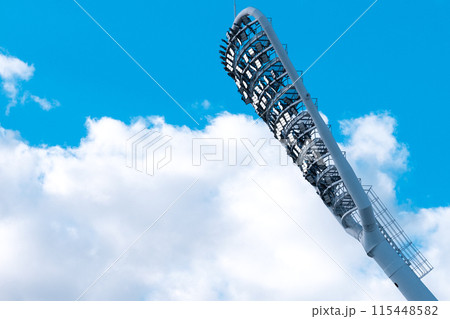 Stadium light with copy space. Stadium floodlights against a clear blue sky 115448582