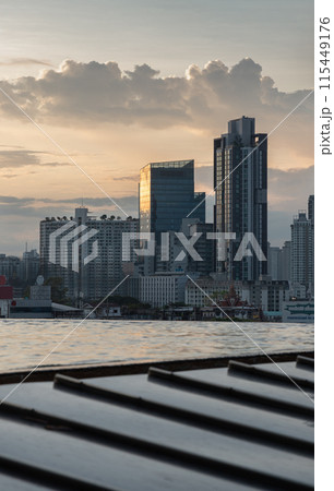 View of Skyscrapers and Dramatic Sky before Sunset. 115449176