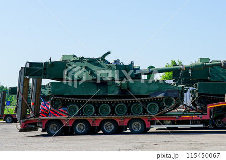 Transportation heavy military equipment on public roads using heavy duty multi axle truck trailers 115450067