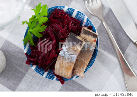 Sliced herring with grated beetroot served on table Sliced herring with grated beetroot served on table 115453846
