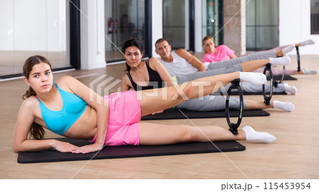 Young sporty woman exercising with pilates ring 115453954