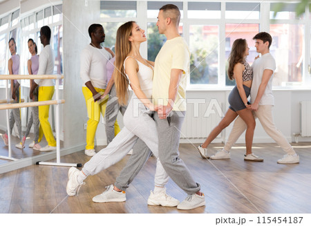 Young man and woman dancing latin dances 115454187