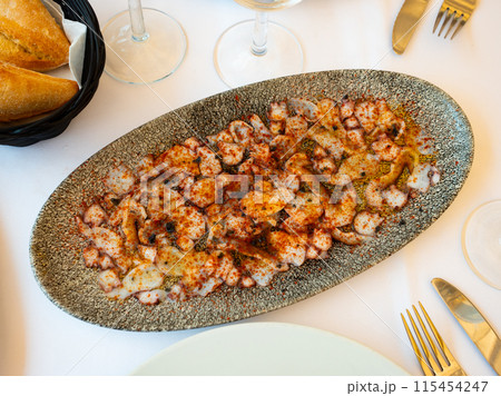 Seafood carpaccio from octopus tentacles with smoked paprika Seafood carpaccio from octopus tentacles with smoked paprika 115454247