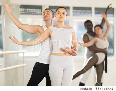 Man and woman perform paired ballet dance Man and woman perform paired ballet dance 115454283