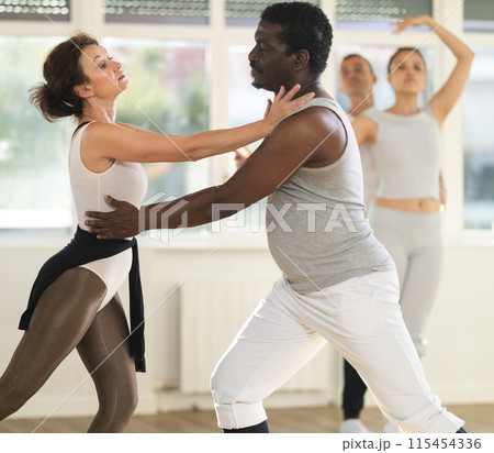 Adult man and adult woman rehearsing pair ballet 115454336