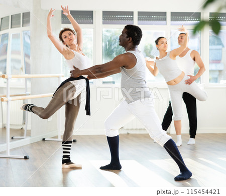 Adult man and adult woman rehearsing pair ballet 115454421