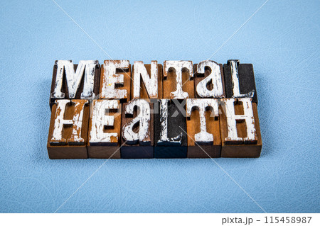 MENTAL HEALTH. Wooden alphabet letter blocks on blue textured background MENTAL HEALTH. Wooden alphabet letter blocks on blue textured background 115458987