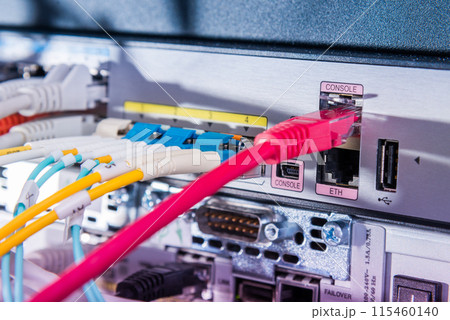 fiber optic cables connected to optic ports, network cables connected to ethernet ports fiber optic cables connected to optic ports, network cables connected to ethernet ports 115460140