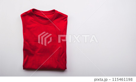 a colored blank t-shirt is folded neatly, ironed, placed in the frame for mockup 115461198