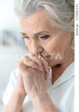 Portrait of a sad elderly woman posing at home Portrait of a sad elderly woman posing at home 115462141