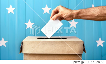 Hand Casting Ballot into Voting Box with Starry Background 115462892