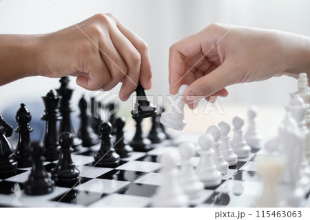 hand of business moving chess in competition shows leadership, followers and business success strategies 115463063