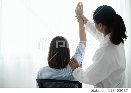 Female physiotherapists provide physical assistance to patients with shoulder injuries massaging their shoulders for muscle recovery in the rehabilitation center. Physiotherapy concepts Female physiotherapists provide physical assistance to patients with shoulder injuries massaging their shoulders for muscle recovery in the rehabilitation center. Physiotherapy concepts 115463087