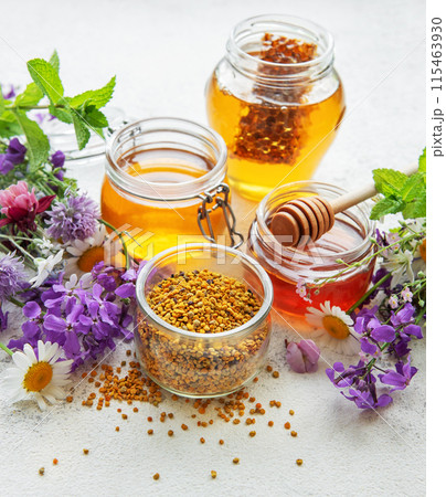 Raw organic bee pollen and honey in jars. Raw organic bee pollen and honey in jars. 115463930