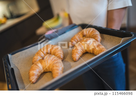 Close up picture of a tray with fresh croissants 115466098