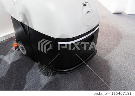 Industrial robot vacuum cleaner at work. Industrial robot vacuum cleaner at work. 115467151