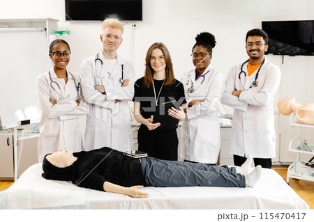 Medical Students Practicing CPR on a Training Dummy Medical Students Practicing CPR on a Training Dummy 115470417