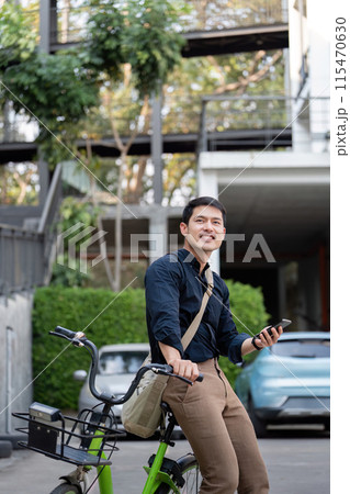 Eco Friendly Businessman on Bicycle Working Outdoors, Promoting Sustainable Transportation and Modern Urban Lifestyle 115470630