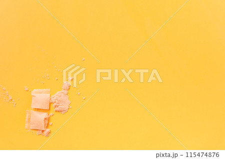Contents of powder in snus bag on yellow background Contents of powder in snus bag on yellow background 115474876