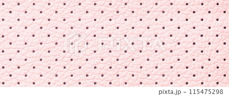 Perforated pink leather texture background, closeup. Light backdrop from wrinkle skin. 115475298